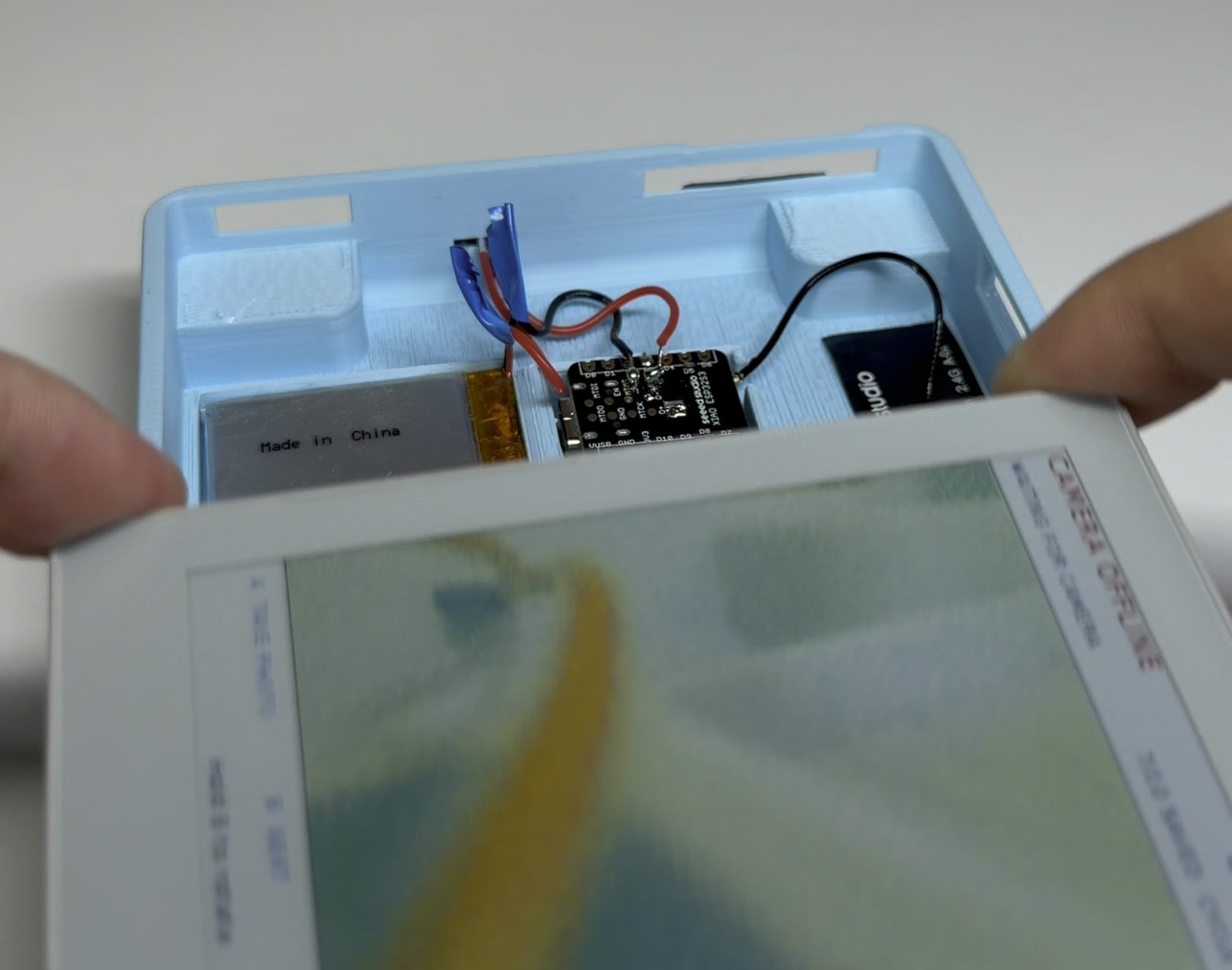The PaperColor being laid into the same shell, on top of the camera electronics.
