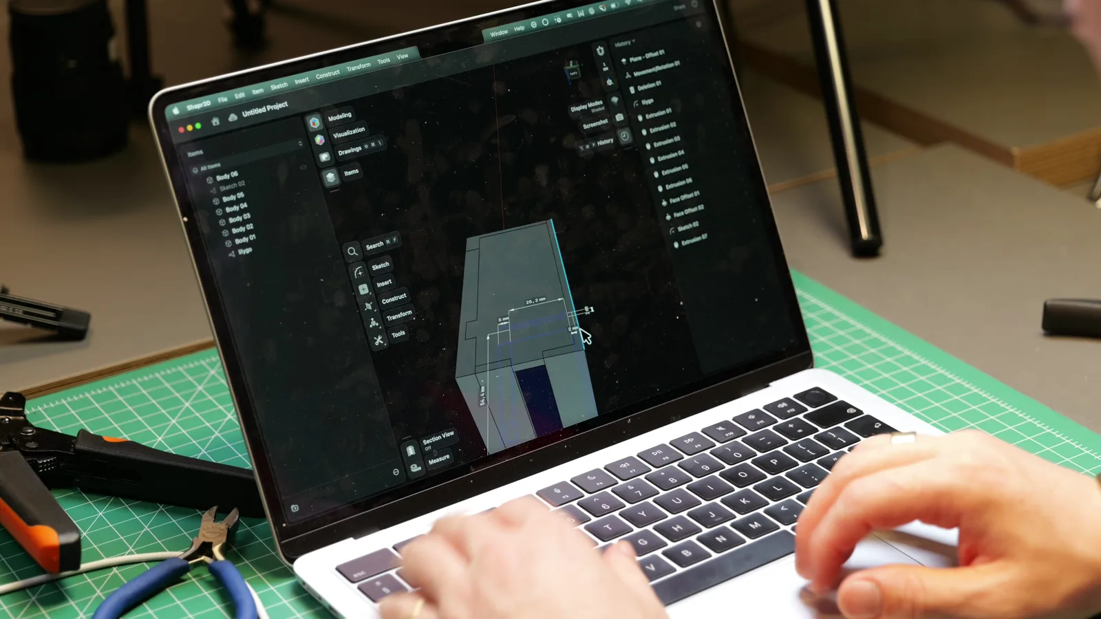 Designing the case around the measured parts in a 3D modelling app.