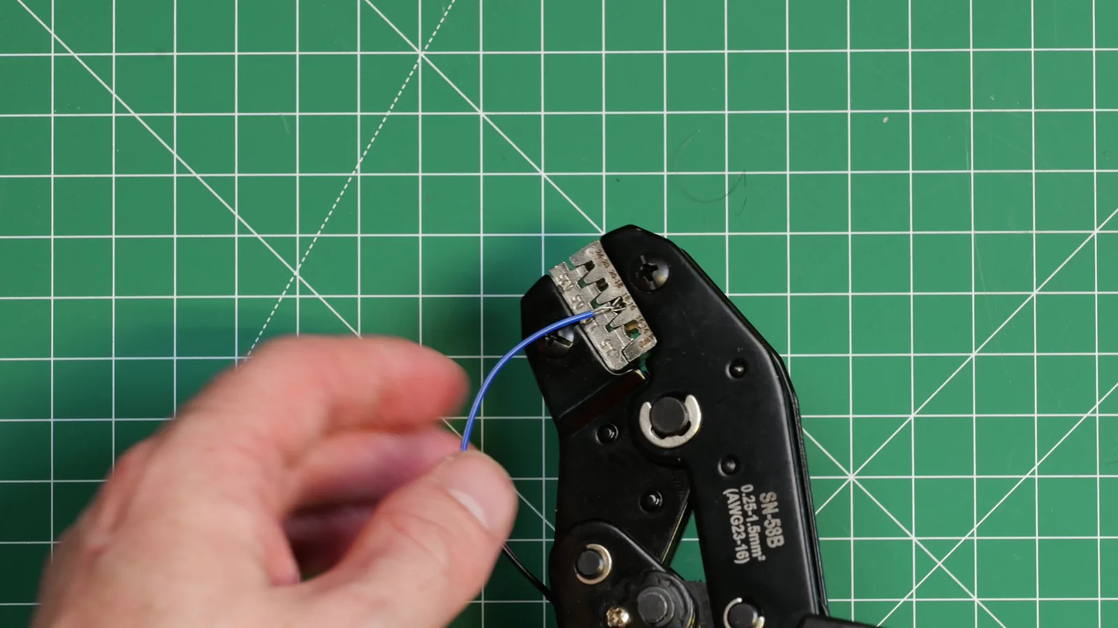 Crimping a female Dupont connector onto the sensor's signal wire.