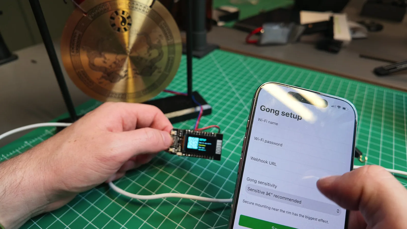 Entering the Wi-Fi details and webhook URL on the Gong Setup page on a phone.